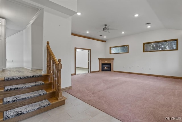 living room featuring recessed lighting, a glass covered fireplace, light carpet, and ceiling fan