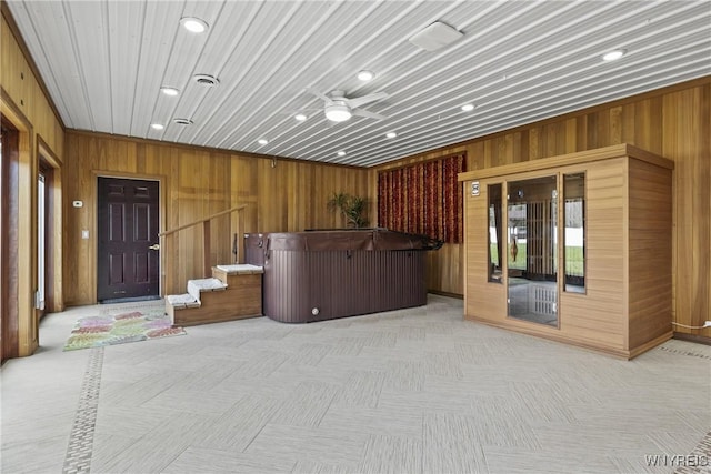 reception with stairway and a ceiling fan