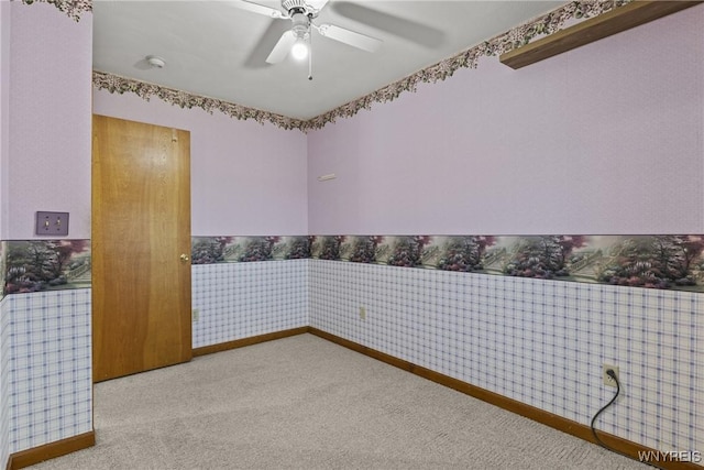 unfurnished room with carpet floors and ceiling fan