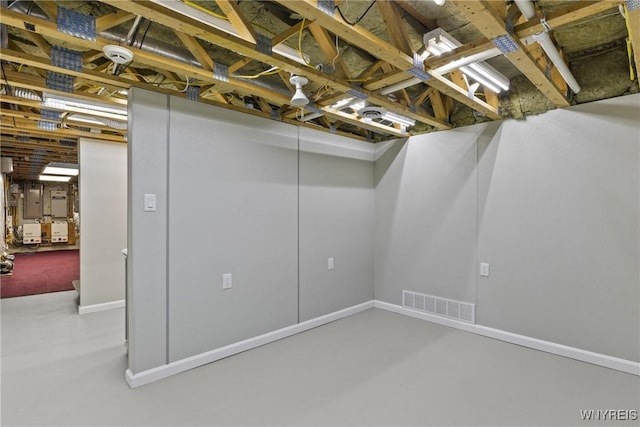 unfinished below grade area featuring baseboards and visible vents