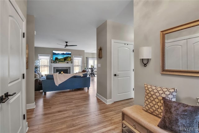 interior space featuring baseboards and wood finished floors
