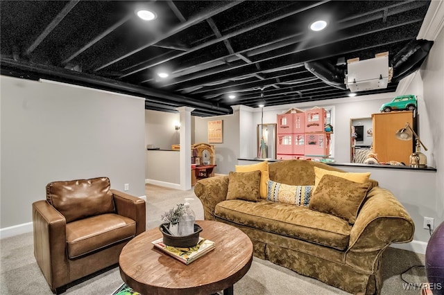 carpeted living room with baseboards