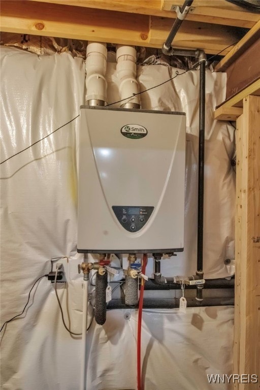 utility room featuring water heater