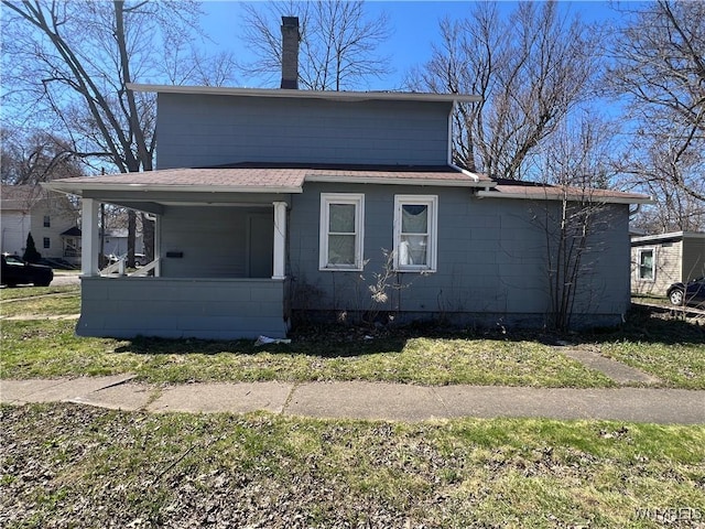180 Spalding St, Lockport-City, NY 14094 - view of front facade with a shingled roof, covered porch, and a front yard