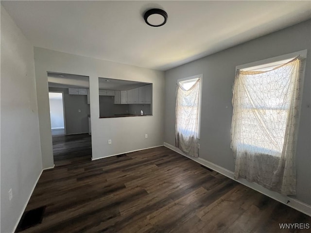 180 Spalding St, Lockport-City, NY 14094 - unfurnished room featuring baseboards and dark wood-style flooring