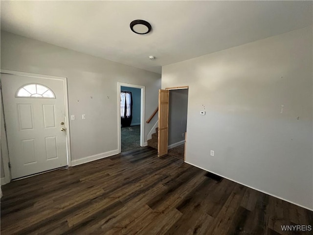 180 Spalding St, Lockport-City, NY 14094 - foyer entrance with baseboards, stairway, and dark wood finished floors