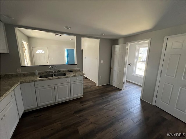 180 Spalding St, Lockport-City, NY 14094 - kitchen featuring recessed lighting, dark wood finished floors, a sink, baseboards, and white cabinetry
