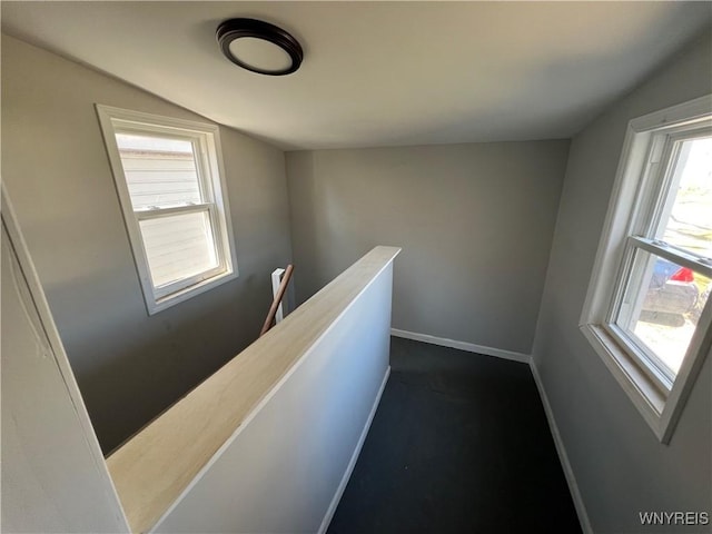 180 Spalding St, Lockport-City, NY 14094 - corridor with vaulted ceiling, an upstairs landing, and baseboards