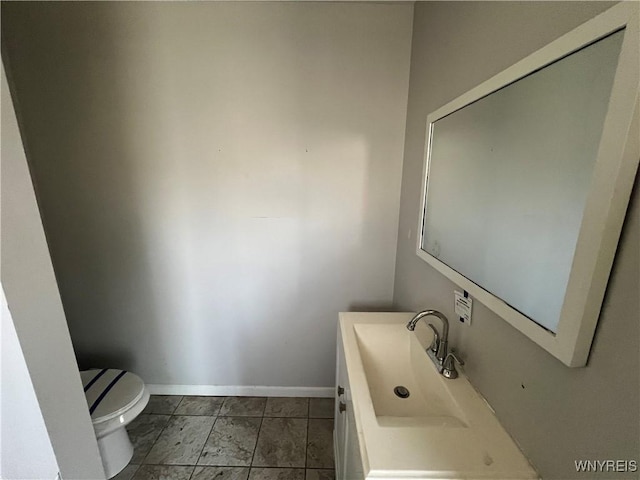 180 Spalding St, Lockport-City, NY 14094 - half bath featuring baseboards, toilet, and vanity