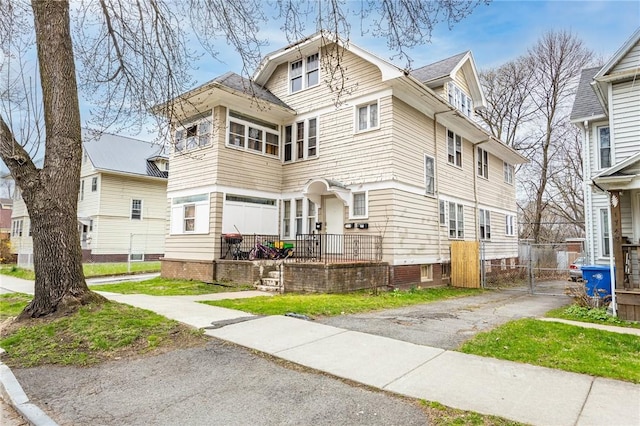 view of front of home with a gate and fence