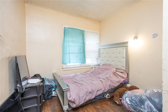 bedroom featuring wood finished floors