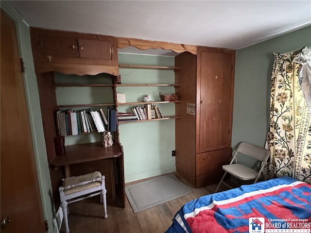 bedroom featuring wood finished floors