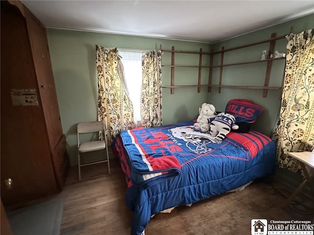 bedroom with wood finished floors