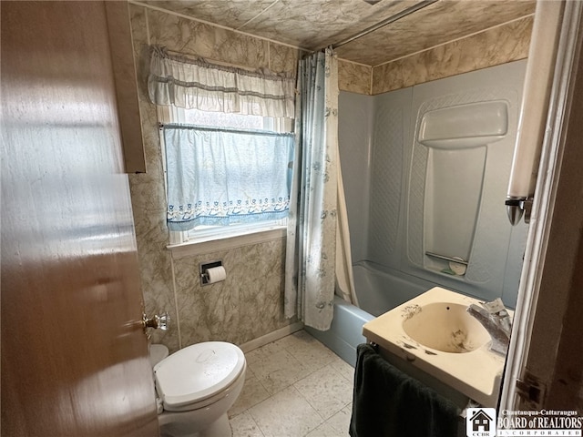 full bath featuring shower / tub combo with curtain, toilet, and vanity
