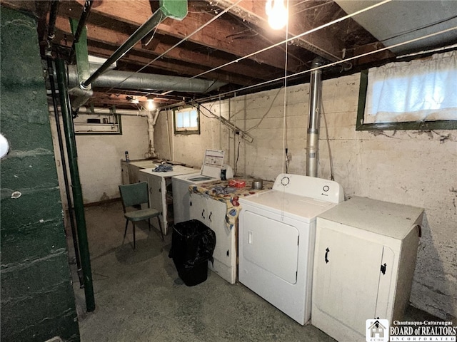 washroom featuring laundry area and independent washer and dryer