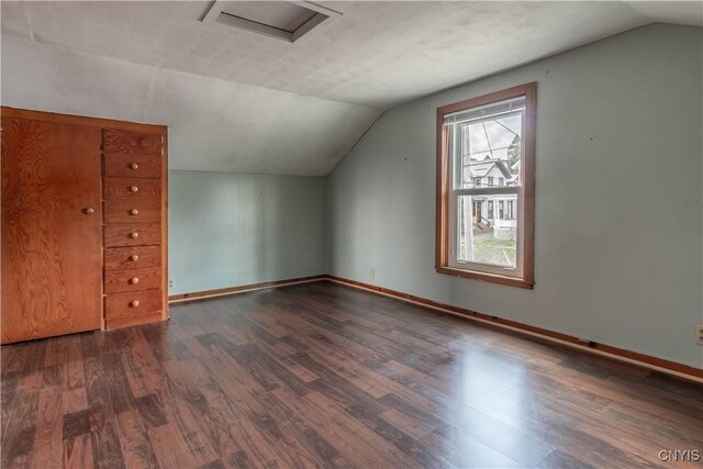 620 W St, Wilna, NY 13619 - bonus room with attic access, baseboards, vaulted ceiling, and wood finished floors