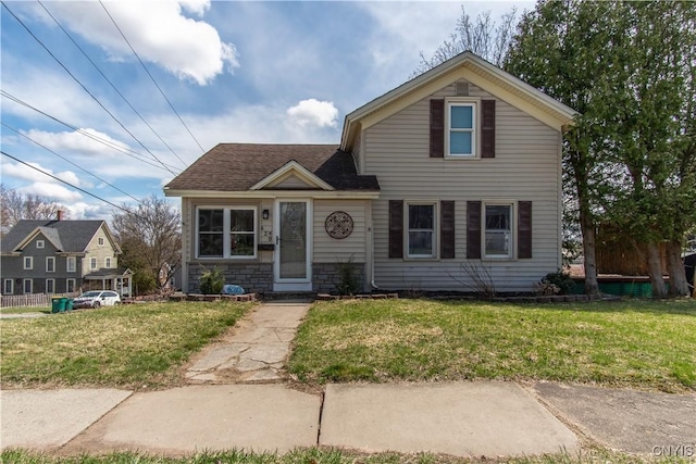 620 W St, Wilna, NY 13619 - traditional-style home with stone siding, a front lawn, and a shingled roof