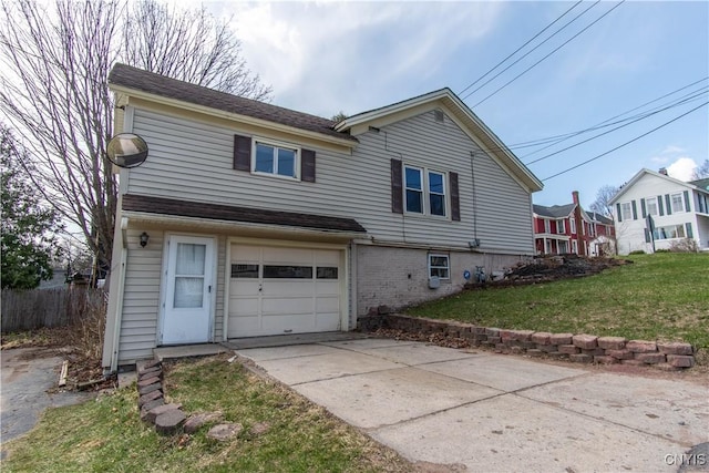 620 W St, Wilna, NY 13619 - exterior space with concrete driveway, a front lawn, and a garage