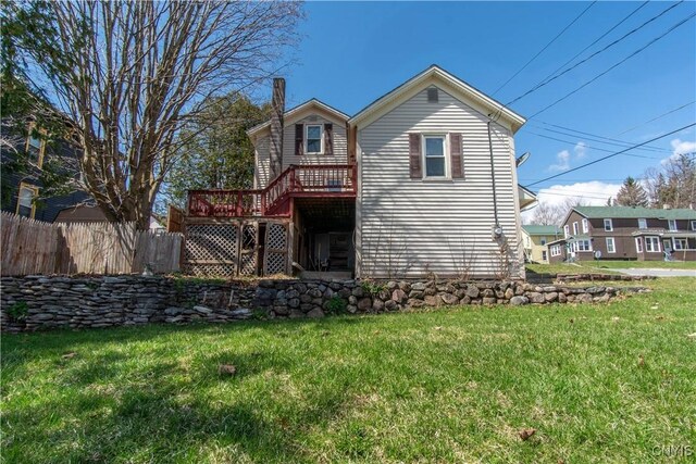 620 W St, Wilna, NY 13619 - back of house with a wooden deck, a lawn, and fence