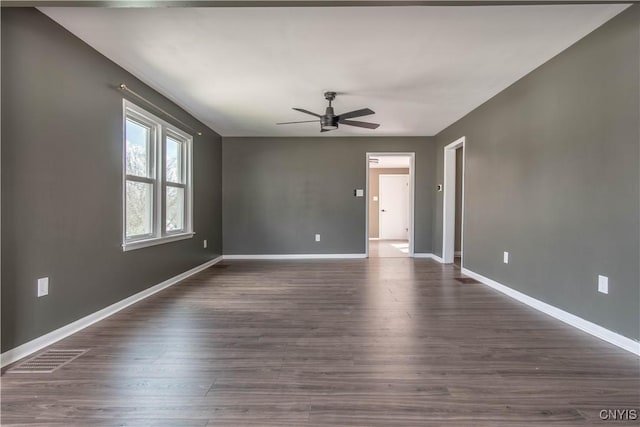 620 W St, Wilna, NY 13619 - spare room featuring ceiling fan, baseboards, and dark wood-type flooring