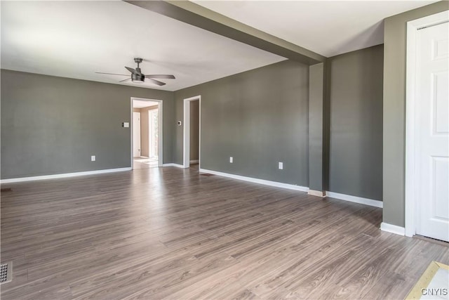 620 W St, Wilna, NY 13619 - empty room featuring visible vents, baseboards, a ceiling fan, and wood finished floors