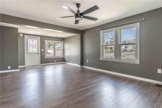 620 W St, Wilna, NY 13619 - unfurnished room featuring dark wood finished floors, visible vents, baseboards, and ceiling fan