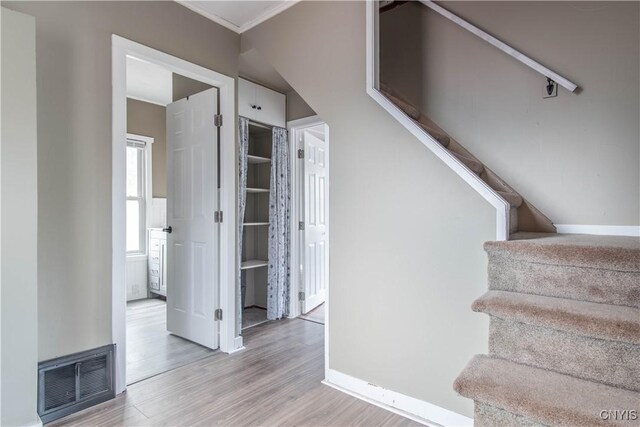 620 W St, Wilna, NY 13619 - stairs with wood finished floors, visible vents, and baseboards