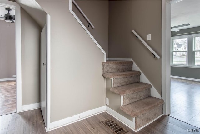 620 W St, Wilna, NY 13619 - stairs featuring wood finished floors, baseboards, a ceiling fan, and visible vents