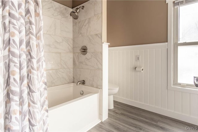 620 W St, Wilna, NY 13619 - bathroom with wood finished floors, a healthy amount of sunlight, toilet, and shower / bath combo with shower curtain