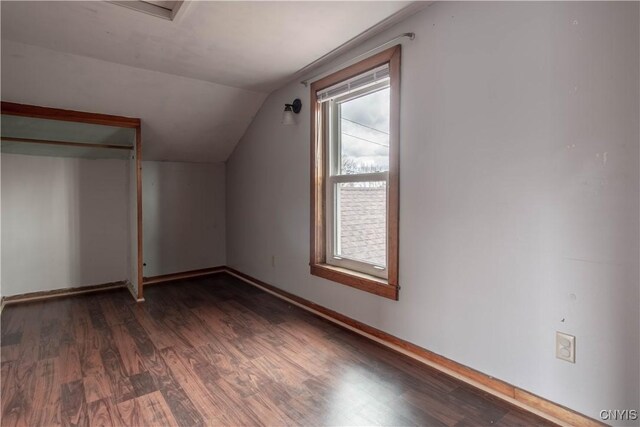 620 W St, Wilna, NY 13619 - additional living space featuring vaulted ceiling, wood finished floors, and baseboards
