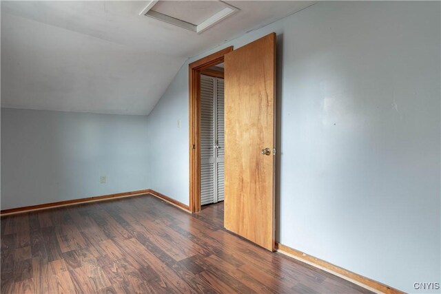 620 W St, Wilna, NY 13619 - bonus room with lofted ceiling, attic access, baseboards, and dark wood finished floors