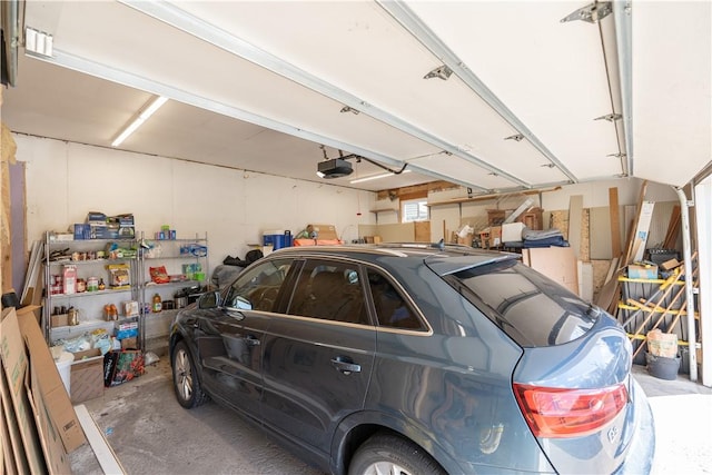 739 Pre Emption Rd, Geneva-City, NY 14456 - garage featuring a garage door opener