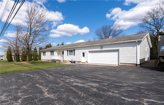 739 Pre Emption Rd, Geneva-City, NY 14456 - ranch-style home with a garage, driveway, and a front lawn