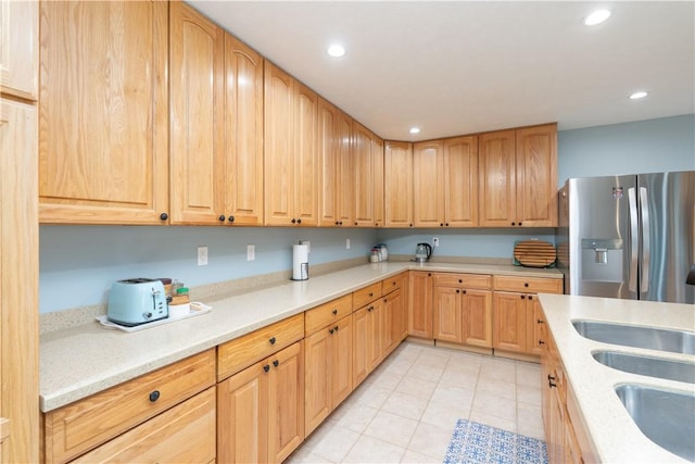 739 Pre Emption Rd, Geneva-City, NY 14456 - kitchen featuring light brown cabinets, light tile patterned floors, stainless steel fridge, light countertops, and recessed lighting