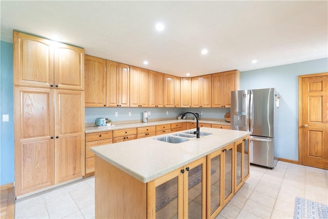 739 Pre Emption Rd, Geneva-City, NY 14456 - kitchen with a sink, stainless steel fridge, a center island with sink, recessed lighting, and light countertops