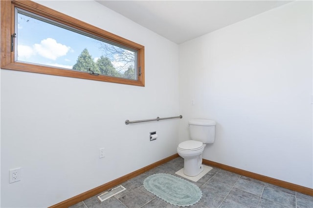739 Pre Emption Rd, Geneva-City, NY 14456 - bathroom with baseboards, visible vents, tile patterned flooring, and toilet