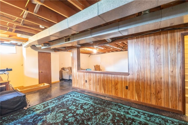 739 Pre Emption Rd, Geneva-City, NY 14456 - basement featuring wood walls and baseboards