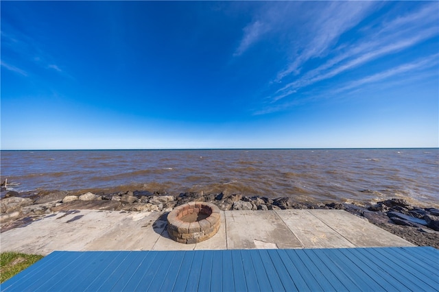 view of water feature with an outdoor fire pit