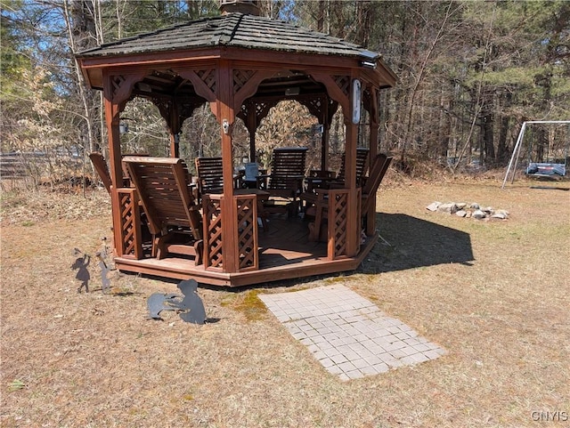 view of yard featuring a wooden deck and a gazebo