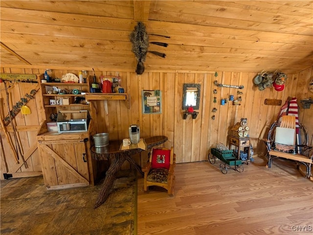 office with wood finished floors, wood walls, and wood ceiling