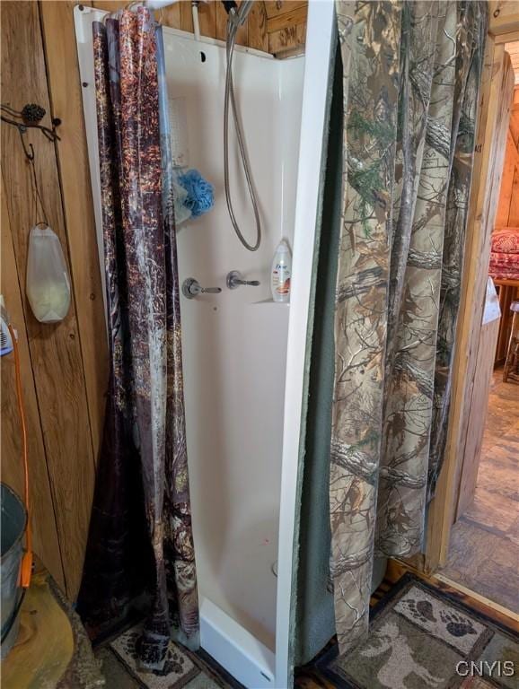 full bathroom featuring a stall shower