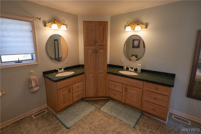 full bathroom with visible vents and vanity