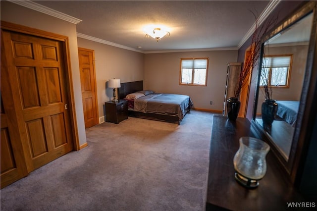 carpeted bedroom featuring crown molding and baseboards