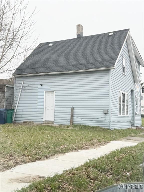 720 Sherman St, Buffalo, NY 14211 - back of house with roof with shingles and a chimney
