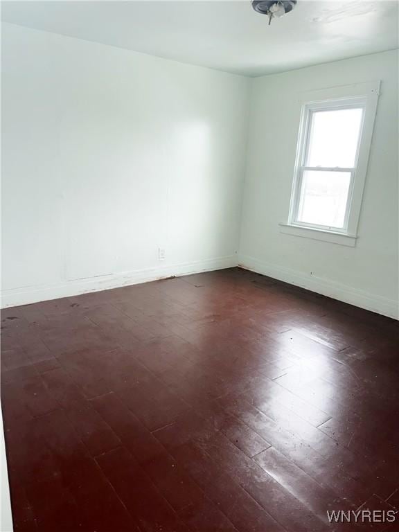 720 Sherman St, Buffalo, NY 14211 - unfurnished room featuring dark wood finished floors and baseboards