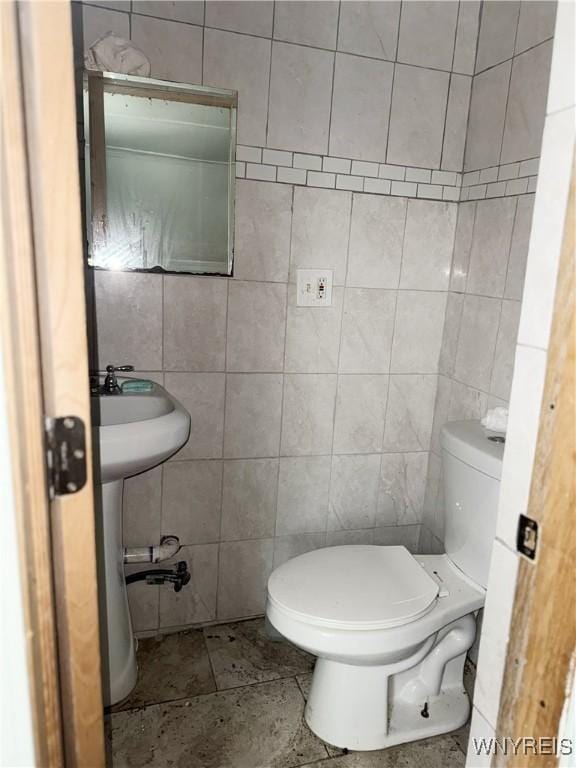 720 Sherman St, Buffalo, NY 14211 - bathroom featuring tile walls and toilet