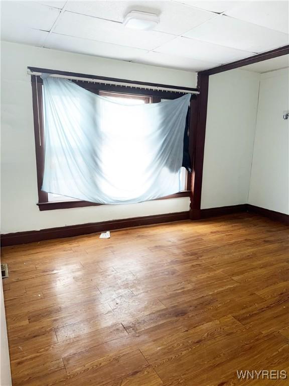 720 Sherman St, Buffalo, NY 14211 - empty room with wood finished floors and baseboards