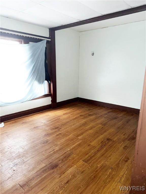 720 Sherman St, Buffalo, NY 14211 - unfurnished room featuring wood finished floors and baseboards