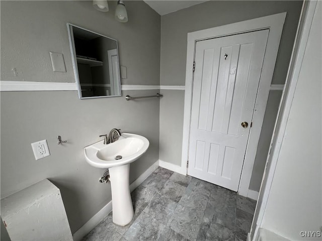 bathroom featuring baseboards
