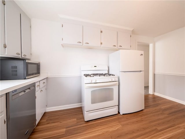 kitchen featuring light countertops, light wood-type flooring, white cabinetry, and stainless steel appliances